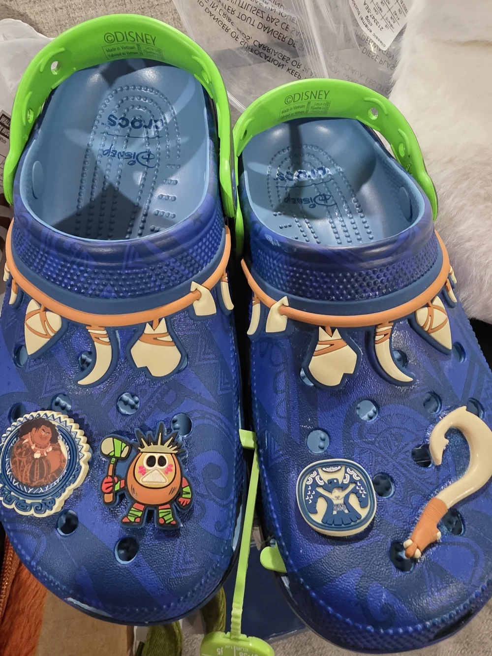 CROCS Kids Blue Clog Sandals with Neon Green Straps and Decorative Charms